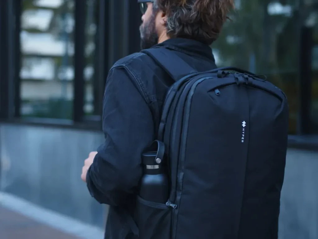 Hyper Backpack – {Tech} for Travel a man wearing a backpack. CES 2026 News: Hyper and Targus. {Tech} for Travel. https://techfortravel.co.uk