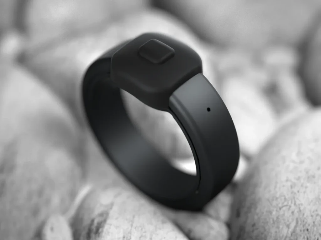 Pebble Index 01 Memory Ring Black – {Tech} for Travel a black band on a white surface. CES 2026 News. Pebble Index 01 Memory Ring. {Tech} for Travel. https://techfortravel.co.uk