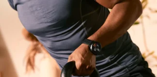 AI training Amazfit Active Max brings Zepp Coach to workouts a person holding a kettlebell. Amazfit Active Max. {Tech} for Travel. https://techfortravel.co.uk