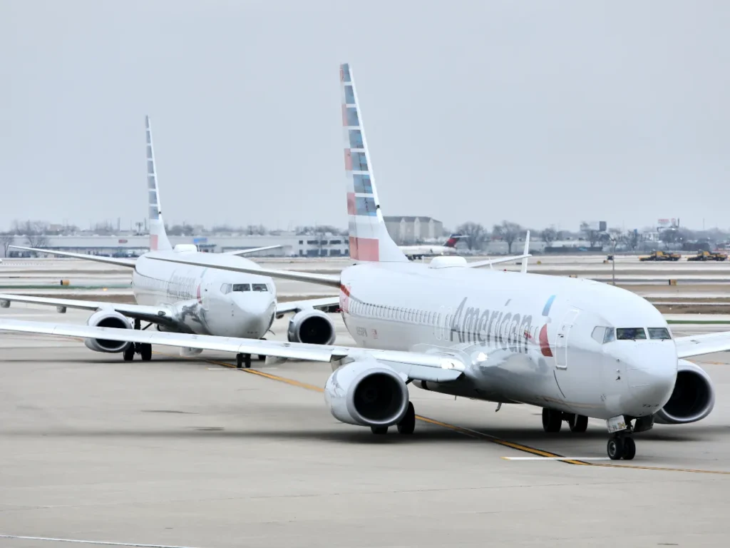 American Airlines Wi-Fi – {Tech} for Travel two airplanes on the runway. American Airlines Wi-Fi. {Tech} for Travel. https://techfortravel.co.uk