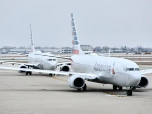 American Airlines Wi-Fi โ {Tech} for Travel two airplanes on the runway. American Airlines Wi-Fi. {Tech} for Travel. https://techfortravel.co.uk
