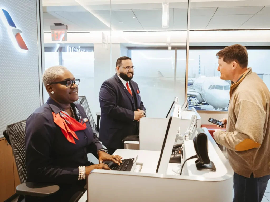 American Airlines customer service – {Tech} for Travel a group of people at a desk. American Airlines app update. {Tech} for Travel. https://techfortravel.co.uk