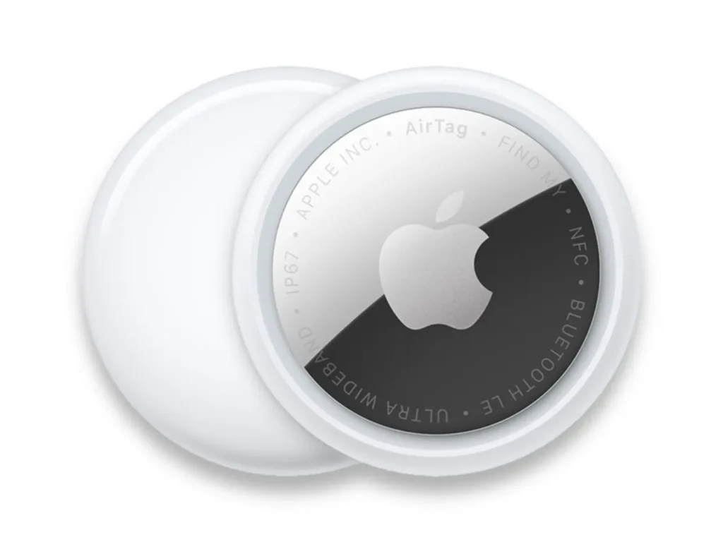 a white round object with a black and silver logo. Apple AirTag 2. {Tech} for Travel. https://techfortravel.co.uk