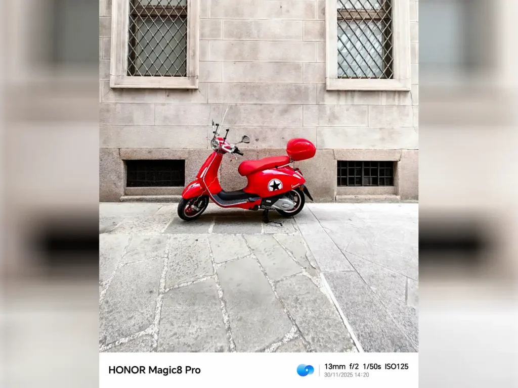 a red scooter parked on a sidewalk. HONOR Magic8 Pro review. {Tech} for Travel. https://techfortravel.co.uk