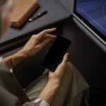Lufthansa Wi-Fi boosted by new Starlink collaboration a person holding a phone. Lufthansa Wi-Fi. {Tech} for Travel. https://techfortravel.co.uk