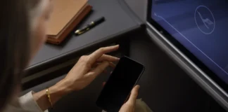 Lufthansa Wi-Fi boosted by new Starlink collaboration a person holding a phone. Lufthansa Wi-Fi. {Tech} for Travel. https://techfortravel.co.uk