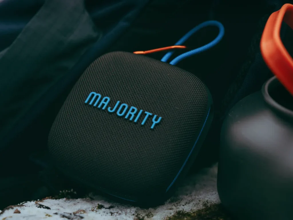 a black square speaker with blue and orange cord. Majority portable speakers, Move 1. {Tech} for Travel. https://techfortravel.co.uk