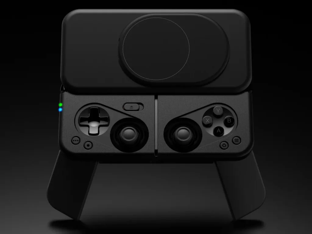 Ohsnap MCON Controller – {Tech} for Travel a black gaming controller with a round button. Ohsnap MCON Controller. {Tech} for Travel. https://techfortravel.co.uk