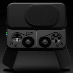 a black gaming controller with a round button. Ohsnap MCON Controller. {Tech} for Travel. https://techfortravel.co.uk