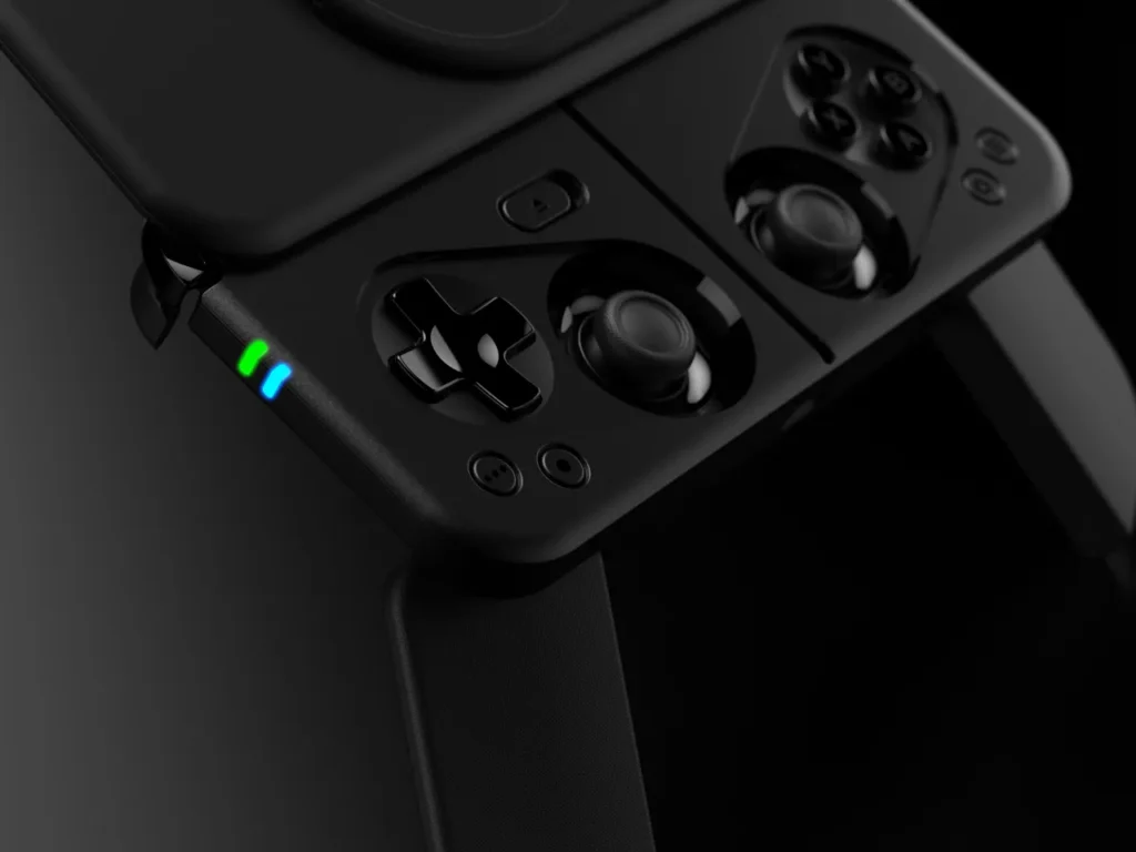Ohsnap MCON Controller Joysticks – {Tech} for Travel a black gaming controller with buttons and a green light. Ohsnap MCON Controller. {Tech} for Travel. https://techfortravel.co.uk