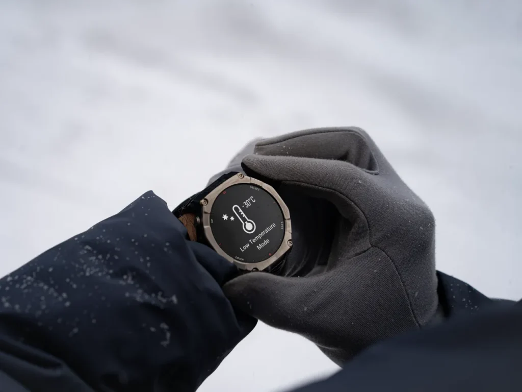 Amazfit T-Rex Ultra 2 low temp mode – {Tech} for Travel a person wearing gloves and a watch. Amazfit T-Rex Ultra 2. {Tech} for Travel. https://techfortravel.co.uk