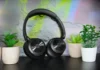 OneOdio Focus A1 Pro Review: Hybrid ANC on a Budget a pair of black headphones on a black surface. OneOdio Focus A1 Pro Review. {Tech} for Travel. https://techfortravel.co.uk