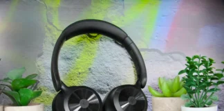 OneOdio Focus A1 Pro Review: Hybrid ANC on a Budget a pair of black headphones on a black surface. OneOdio Focus A1 Pro Review. {Tech} for Travel. https://techfortravel.co.uk