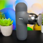 RENPHO Mini Thermal Massage Gun Review: Warm Recovery Anywhere a device on a table. RENPHO Mini Thermal Massage Gun review. {Tech} for Travel. https://techfortravel.co.uk