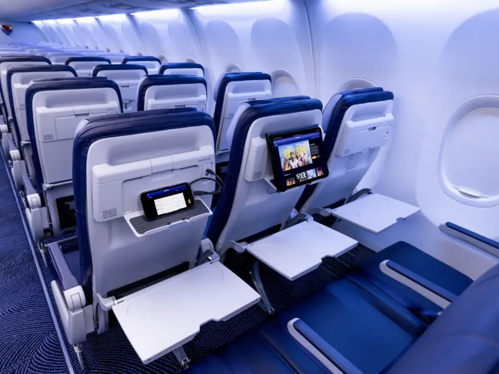 a row of seats in an airplane. Southwest Starlink Wifi. {Tech} for Travel. https://techfortravel.co.uk