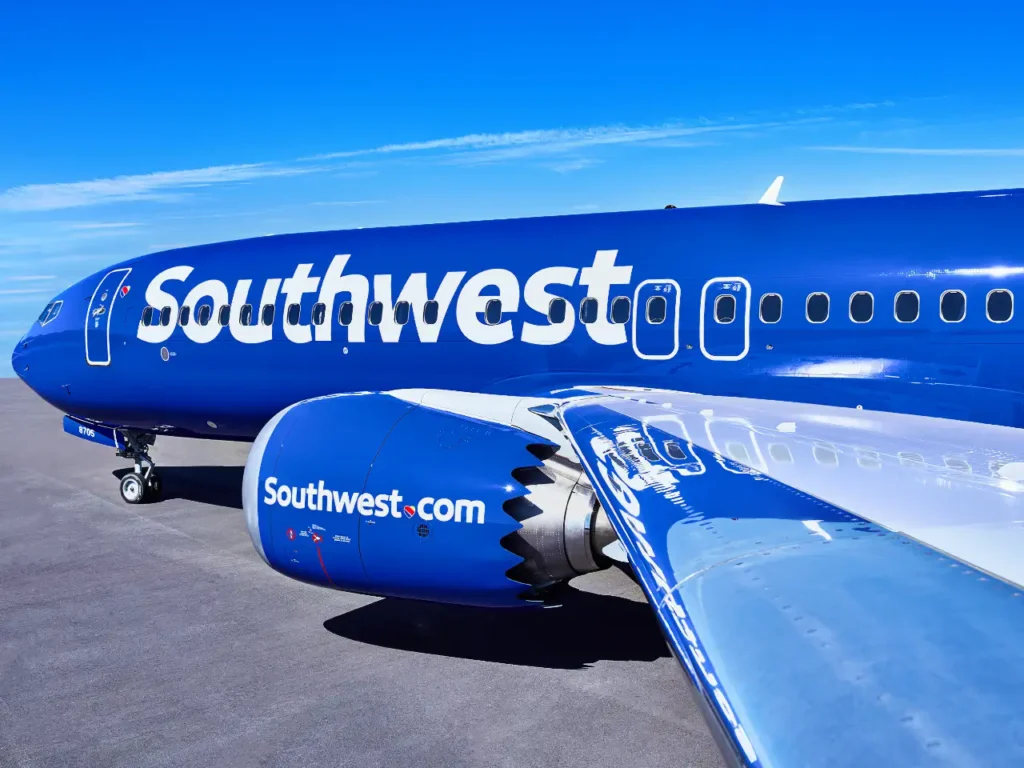 a blue airplane with white text on it. Southwest Starlink Wifi. {Tech} for Travel. https://techfortravel.co.uk