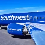 a blue airplane with white text on it. Southwest Starlink Wifi. {Tech} for Travel. https://techfortravel.co.uk