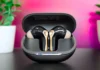 SoundPEATS Air5 Pro Plus Review: Powerful Noise Cancelling in a Light Design a black and gold earbuds in a case